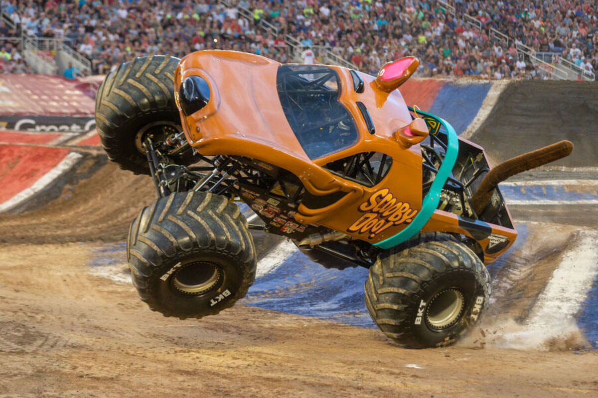 Scooby Monster Jam truck flying through the air.