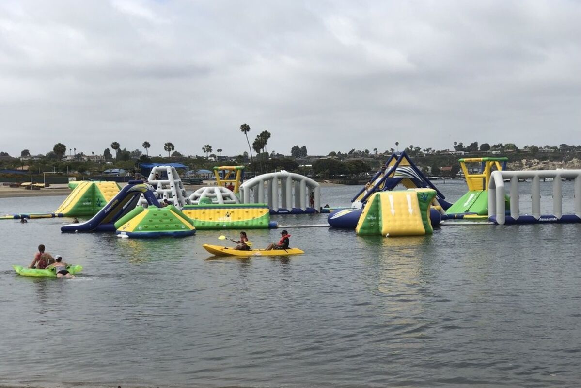 Giant inflatable obstacle course floating in a lagoon