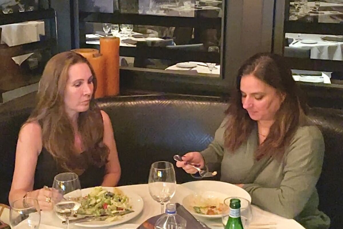 2 women enjoy lunch at Ocean Prime Beverly Hills restaurant.