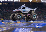 Monster Jam Megalodon truck flying through the air.